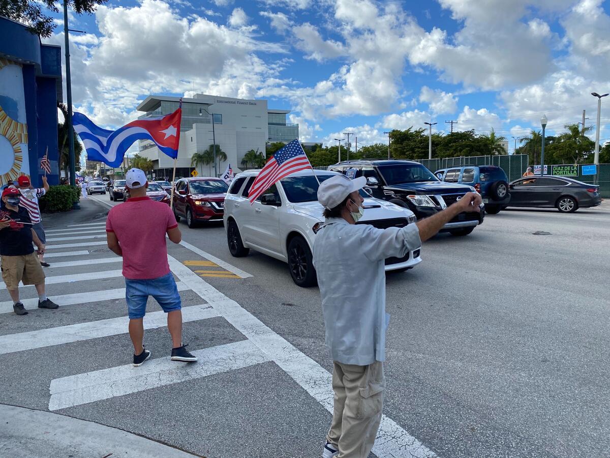On a recent Sunday, a stretch of cars in a Biden caravan were decorated with Biden/Harris signs.