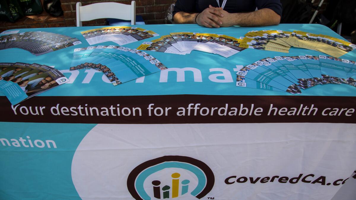 An information table for Covered California at Olvera Street in March. Times).