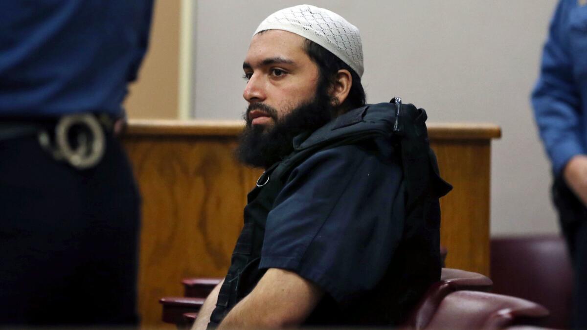 Ahmad Khan Rahimi, the man accused of setting off bombs in New Jersey and New York's Chelsea neighborhood, sits in court in Elizabeth, N.J., in December.