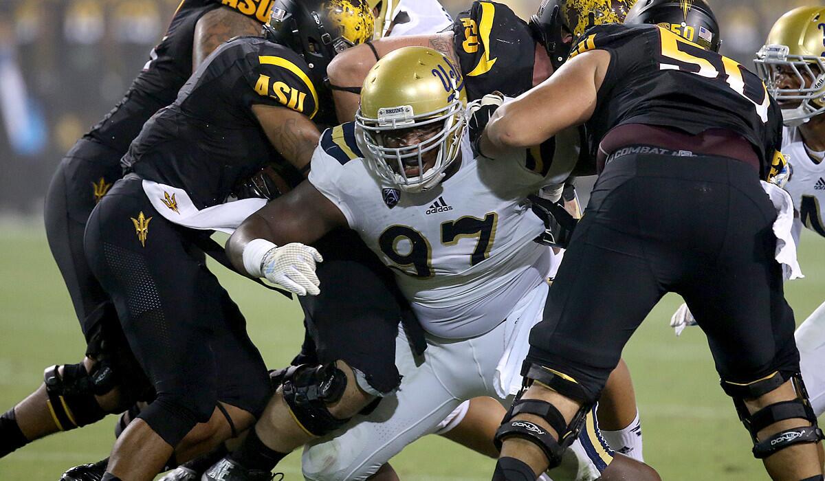 UCLA defensive lineman Kenny Clark tries to break through a double-team block against Arizona State on Sept. 25.