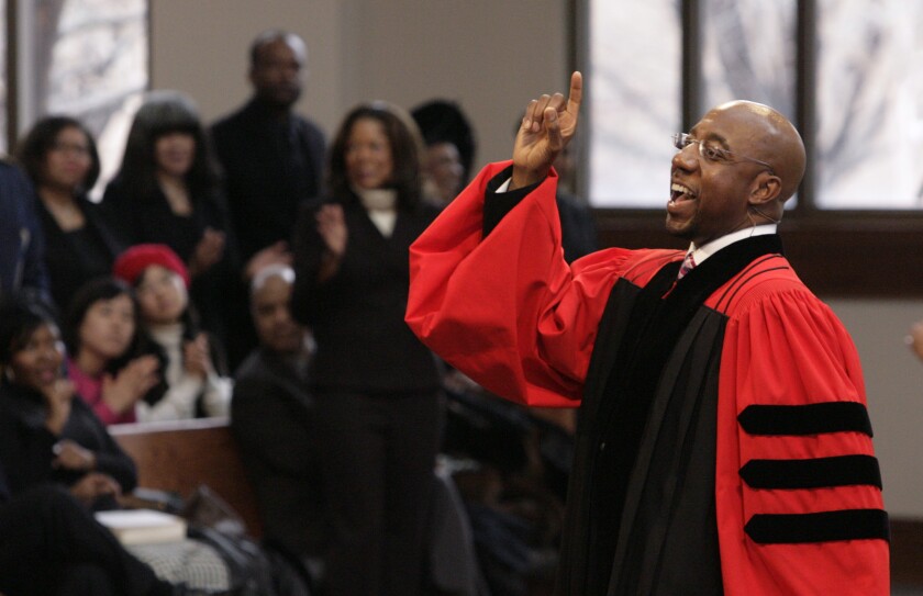 FILE - In this Sunday Jan. 18, 2009 file photo, Rev. Raphael Warnock delivers a sermon during a church service at Ebenezer Baptist Church in Atlanta. Warnock is senior pastor at Ebenezer, the church where the late Dr. Martin Luther King once also pastored. (AP Photo/John Amis)
