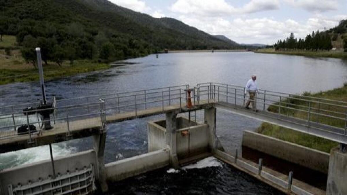 The Moccasin Reservoir on the Tuolumne River stores supplies for San Francisco and the Bay Area. San Francisco and some San Joaquin Valley irrigation districts will have to reduce what they take under newly adopted state standards.