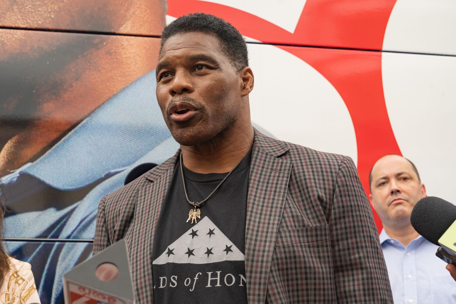 Herschel Walker and Raphael Warnock head to runoff in Georgia Senate election rife with controversy