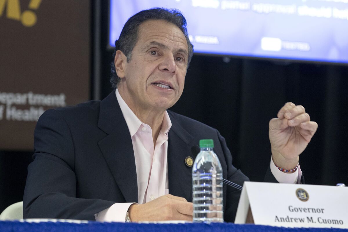 In this Nov. 25, 2020, photo provided by the Office of Governor Andrew Cuomo, Gov. Cuomo speaks in Rochester, N.Y. Cuomo is one of several contenders under consideration by President-elect Joe Biden for the role of attorney general. (Mike Groll/Office of Governor Andrew M. Cuomo)
