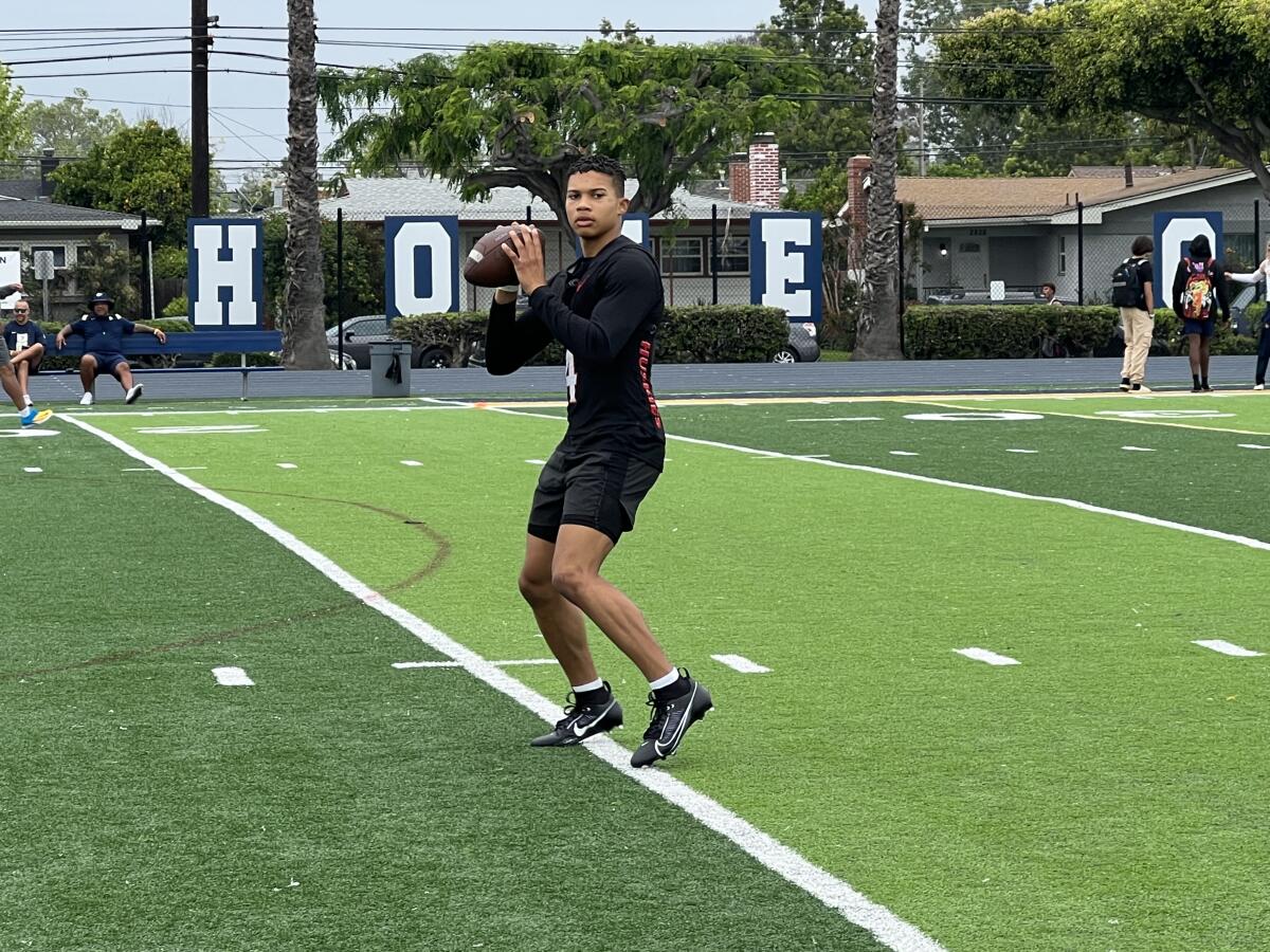 Corona Centennial quarterback Husan Longstreet readies to throw.