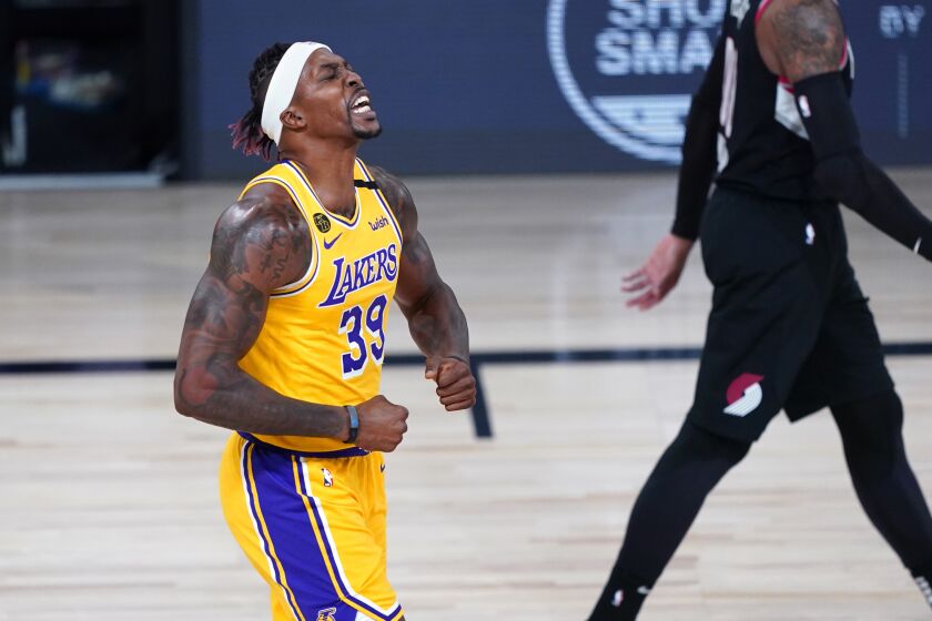 Los Angeles Lakers center Dwight Howard (39) reacts after a slam dunk during the first half of an NBA basketball game against the Portland Trail Blazers Tuesday, Aug. 18, 2020, in Lake Buena Vista, Fla. (AP Photo/Ashley Landis, Pool)