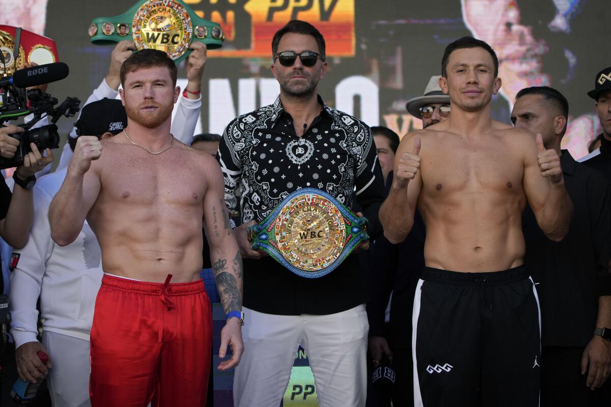 Canelo Alvarez, left, and Gennady Golovkin pose during a ceremonial weigh-in Friday