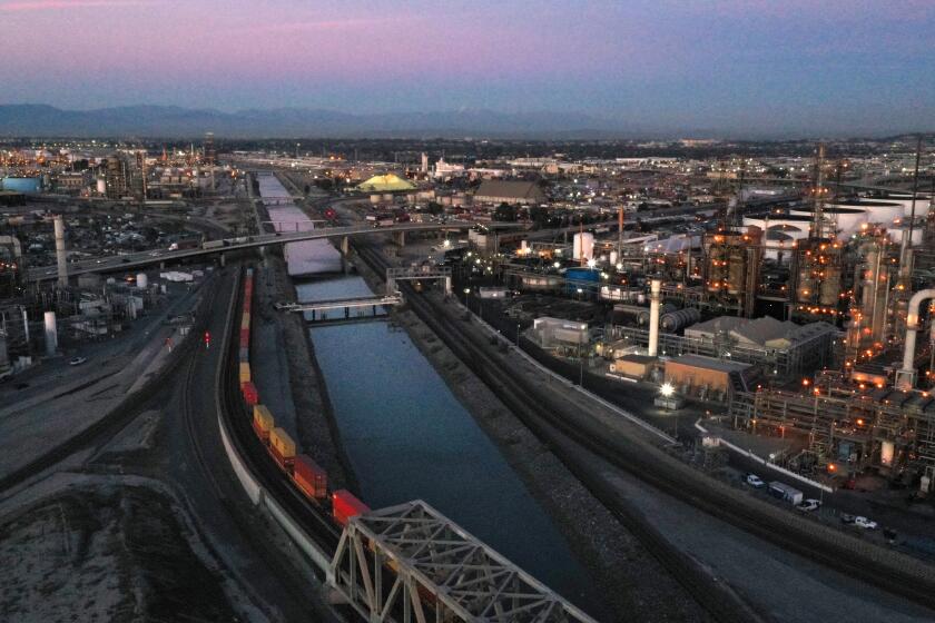 Los Angeles, California-Feb. 8, 2022-The 15-mile-long Dominguez Channel remains a neglected, trash-strewn waterway designed to flush pollution discharged from surrounding neighborhoods, industrial facilities and oil refineries out into the Pacific Ocean. Four months ago, a warehouse fire sent millions of gallons of hand-sanitizer liquid laced with carcinogenic substances sloshing into the Dominguez Channel, poisoning wildlife, churning up a strong, putrid smell of sewage that sickened residents for miles. (Carolyn Cole / Los Angeles Times)