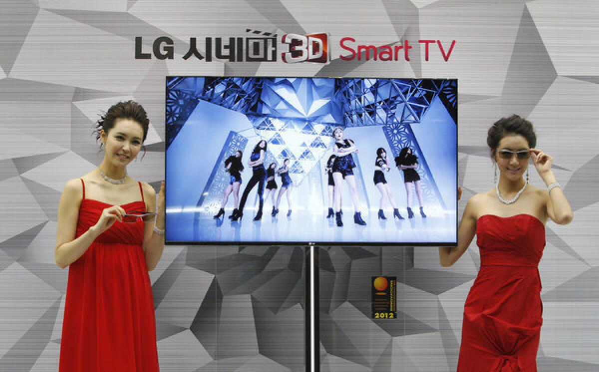 South Korean models pose with an LG Cinema 3D Smart TV. LG has confirmed that its Smart TVs have been gathering information on users' viewing habits even after users opt out.