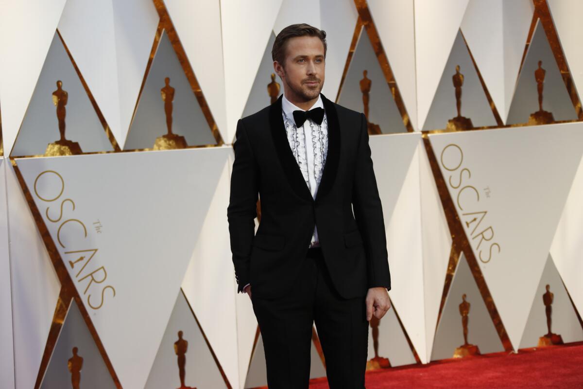 To be kind, maybe Ryan Gosling was simply trying to be on trend and channel a bygone era with this Gucci made-to-order black velvet, shawl lapel, one-button tuxedo, but thanks to the white evening shirt with blue-tipped ruffle details, that bygone era is the high school prom. He'll be spending the rest of the semester on our worst-dressed list.