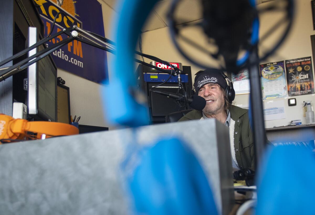 Jim Trenton talks to a listener during his morning show, "Poorman's Morning Rush," on KOCI Radio on Wednesday.