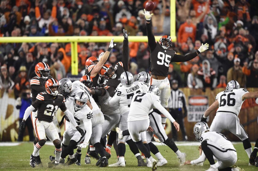 Las Vegas Raiders kicker Daniel Carlson (2) boots a winning 48-yard field goal during the second half of an NFL football game against the Cleveland Browns, Monday, Dec. 20, 2021, in Cleveland. (AP Photo/David Richard)
