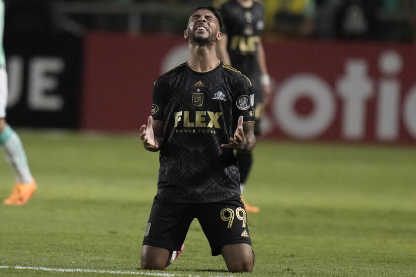 Denis Bouanga of the U.S.' Los Angeles FC celebrates scoring his team's first goal against Mexico's Leon during the first leg of the CONCACAF championship final soccer match at Leon stadium in Guanajuato, Mexico, Wednesday, May 31, 2023. (AP Pho to/Eduardo Verdugo)