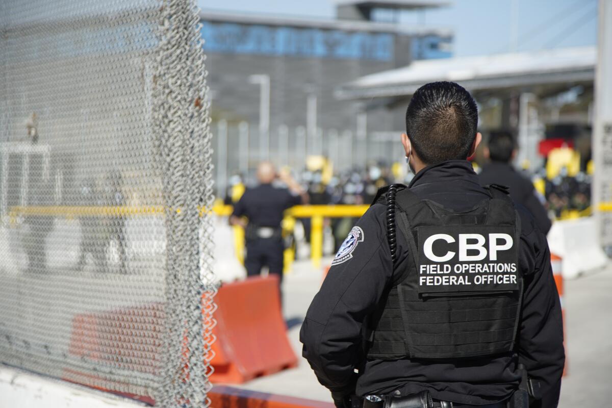 A U.S. Customs and Border Protection officer at the San Ysidro Border Crossing in March.