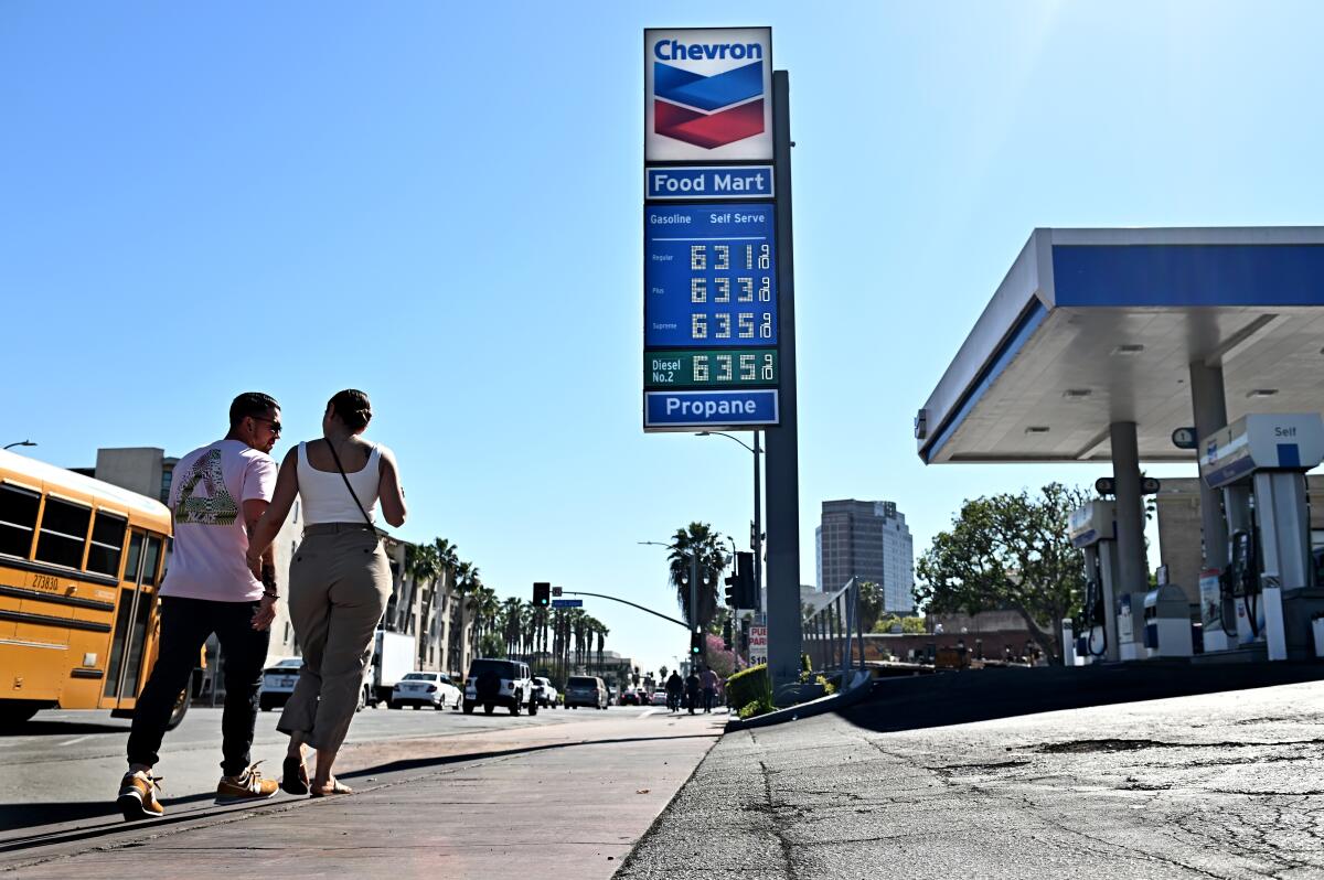 A sign at a gas station shows prices from $6.31 a gallon for regular unleaded to $6.35 for premium