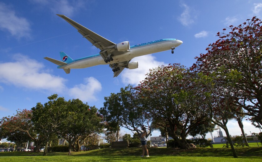 A Korean Air jet comes in for a landing on the northernmost runway at Los Angeles International Airport.