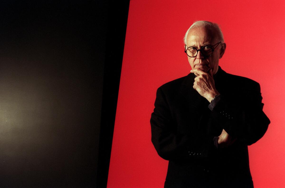 Ellsworth Kelly is photographed in front of one of his works at Peter Carlson Enterprises in Sun Valley in 1996.