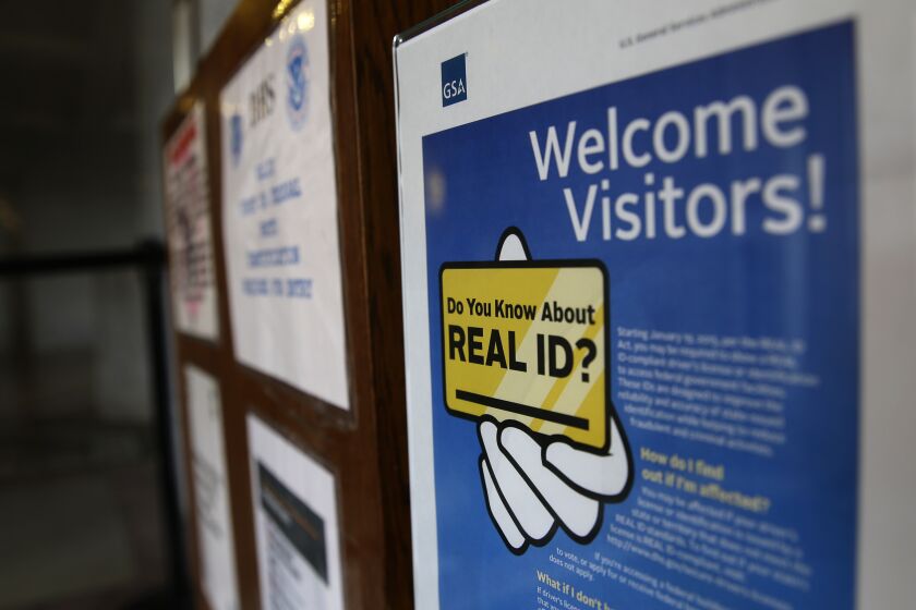 FILE - A sign at the federal courthouse in Tacoma, Wash., is shown on April 6, 2016, to inform visitors of the federal government's REAL ID Act, which requires state driver's licenses and ID cards to have security enhancements and be issued to people who can prove they are legally in the United States. The deadline for obtaining the Real ID needed to board a domestic flight has been pushed back again, with the Department of Homeland Security citing the lingering impact of the COVID-19 pandemic for the slower-than-expected rollout. (AP Photo/Ted S. Warren, File)