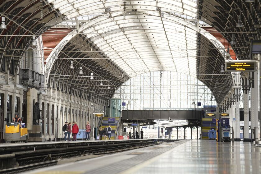 Empty platforms are seen at Paddington train station during a 24-hour strike by four transportation trade unions, in London, Saturday, Oct. 1, 2022. Trains in Britain all but ground to a halt Saturday as coordinated strikes by rail workers added to a week of turmoil caused by soaring energy prices and unfunded tax cuts that roiled financial markets. (James Manning/PA via AP)