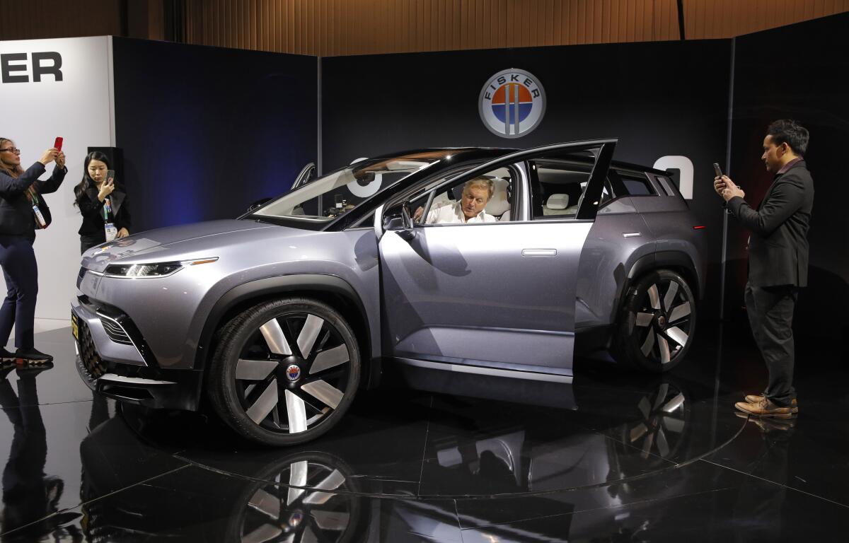 The Fisker Ocean electric SUV on display at a tech show 