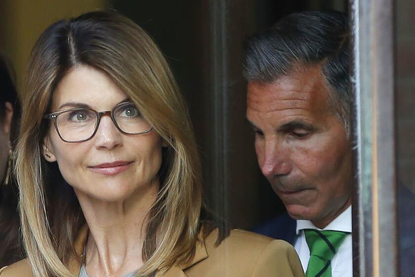 Mandatory Credit: Photo by CJ GUNTHER/EPA-EFE/REX (10185949l) US actress Lori Loughlin (L) and husband Mossimo Giannulli (R) leave the John J Moakley Federal Court House after facing charges in a nationwide college admissions cheating scheme in Boston, Massachusetts, USA 03 April 2019. Lori Loughlin facing charges in a nationwide college admissions cheating scheme, Boston, USA - 03 Apr 2019 ** Usable by LA, CT and MoD ONLY **
