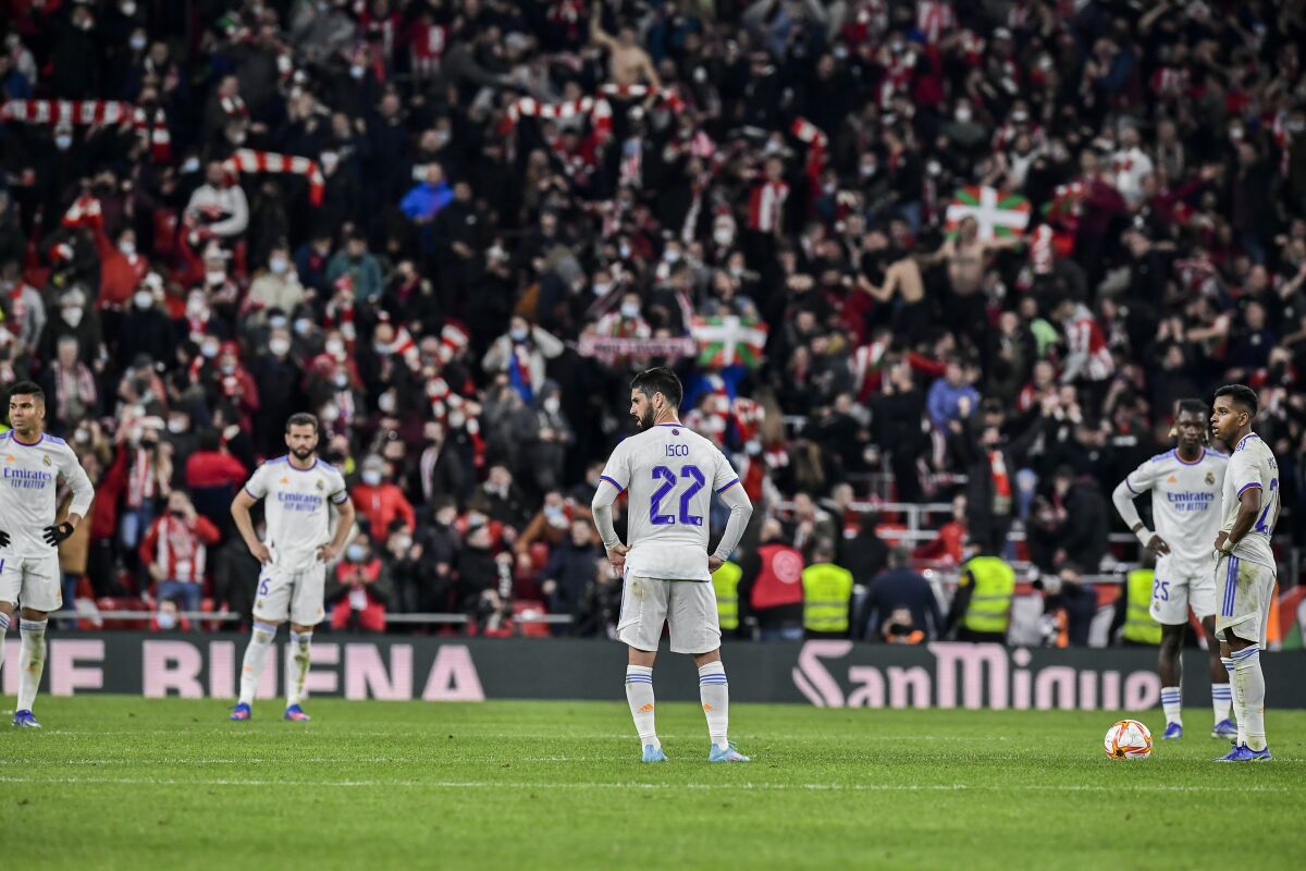 Real Madrid's players react after Athletic Bilbao scored during a Spanish Copa del Rey quarter final soccer match between Athletic Bilbao and Real Madrid at the San Mames stadium in Bilbao, Spain, Thursday, Feb. 3, 2022. (AP Photo/Alvaro Barrientos)