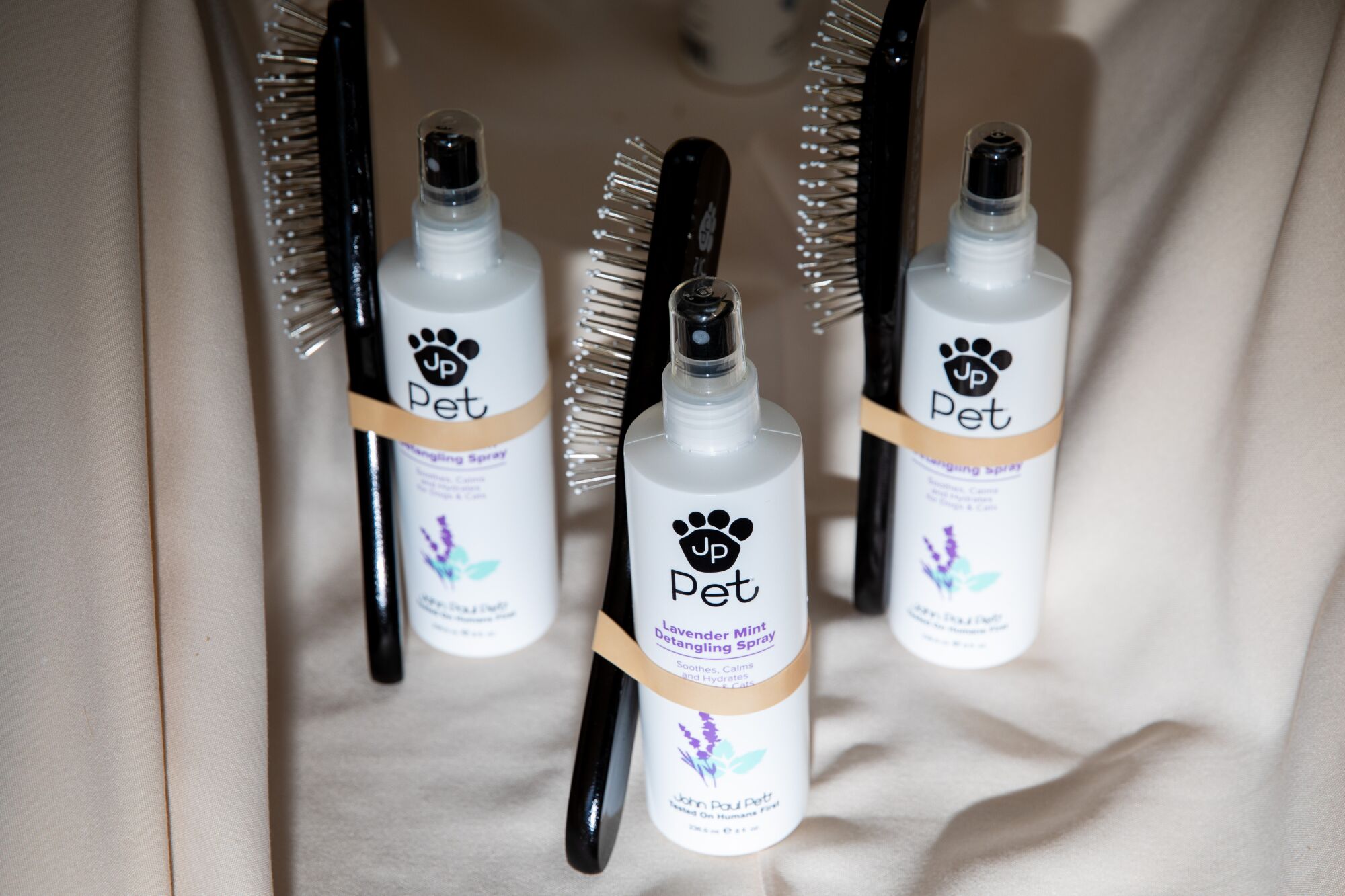 A brush and lavender mint detangling spray by John Paul Pets, which was one of the sponsors on hand.