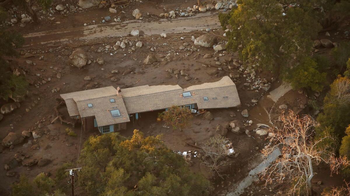 A home in the Romero Canyon area is surrounded by mud and debris in Montecito in an aerial view from a California National Guard Blackhawk Helicopter used for hoist rescues of victims of the mud and debris flows in Montecito.