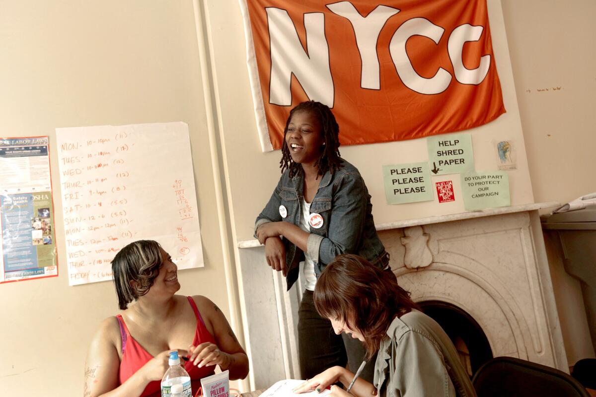 Naquasia LeGrand, center, talks with fellow organizers Lyndsey Sutton, left, and Jessica Wolff at the New York Communities for Change office in Brooklyn on Aug. 27. "This is what I do, it's part of me now, it's like there's no stopping it," she told protesters two days later.