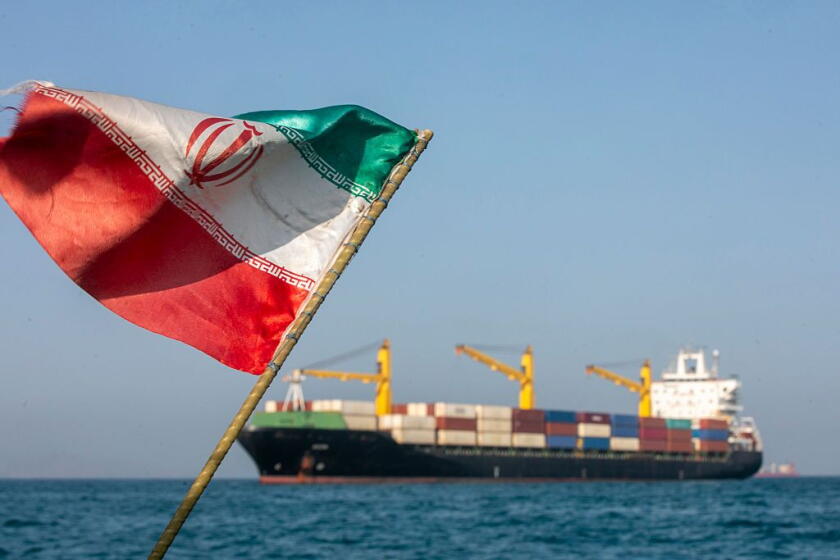STRAIT OF HORMUZ, IRAN - MAY 16: An Iranian flag flutters in the wind as ships remain anchored on May 16, 2026 in the Strait of Hormuz near Larak Island, Iran. Negotiations between the U.S. and Iran over opening this critical waterway have largely stalled as the countries have rejected each other's proposals to end the war that began when the U.S. and Israel attacked Iran on February 28. (Photo by Majid Saeedi/Getty Images) Photographer: Majid Saeedi/Getty Images Europe