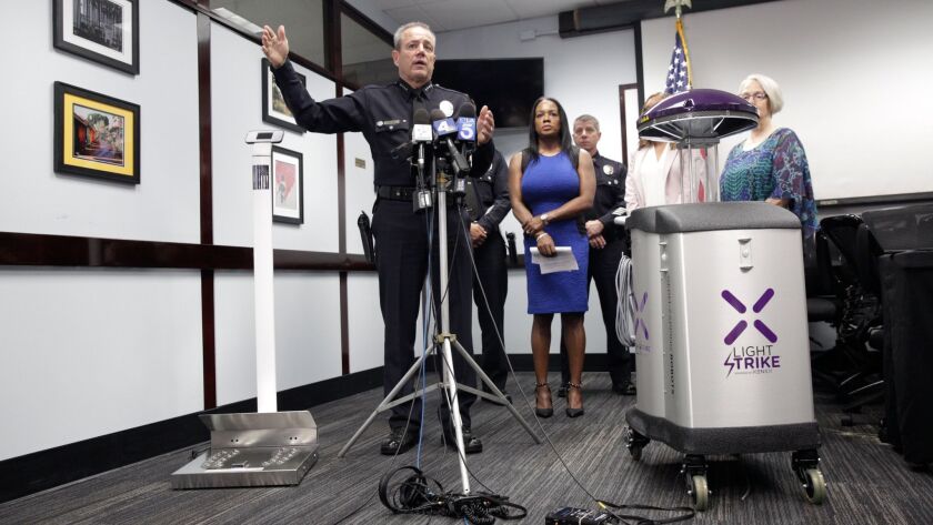 LAPD Chief Michel Moore discusses the new high-tech devices the department is using to kill germs in the Central Division station.