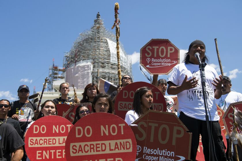 FILE - Tribal councilman Wendsler Nosie Sr. speaks with Apache activists during a rally to save Oak Flat, land near Superior, Ariz., sacred to Western Apache tribes, in front of the U.S. Capitol on July 22, 2015, in Washington. An Apache group battling a foreign mining firm that wants to build one of the largest copper mines in the United States on what tribal members say is sacred land gets a new chance to make its point Tuesday, March 21, 2023, when a full federal appeals court panel takes another look at the case. (AP Photo/Molly Riley, File)