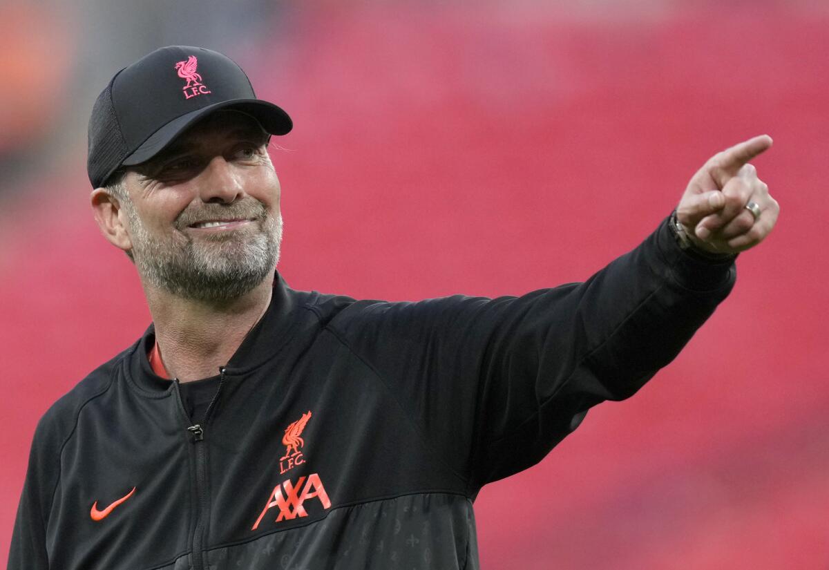 Liverpool's manager Jurgen Klopp smiles and gestures at the end of the English FA Cup final soccer match between Chelsea and Liverpool, at Wembley stadium, in London, Saturday, May 14, 2022. (AP Photo/Kirsty Wigglesworth)