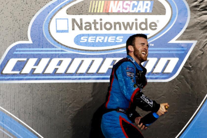 NASCAR driver Austin Dillon celebrates after clinching the Nationwide Series championship on Saturday night at at Homestead-Miami Speedway.