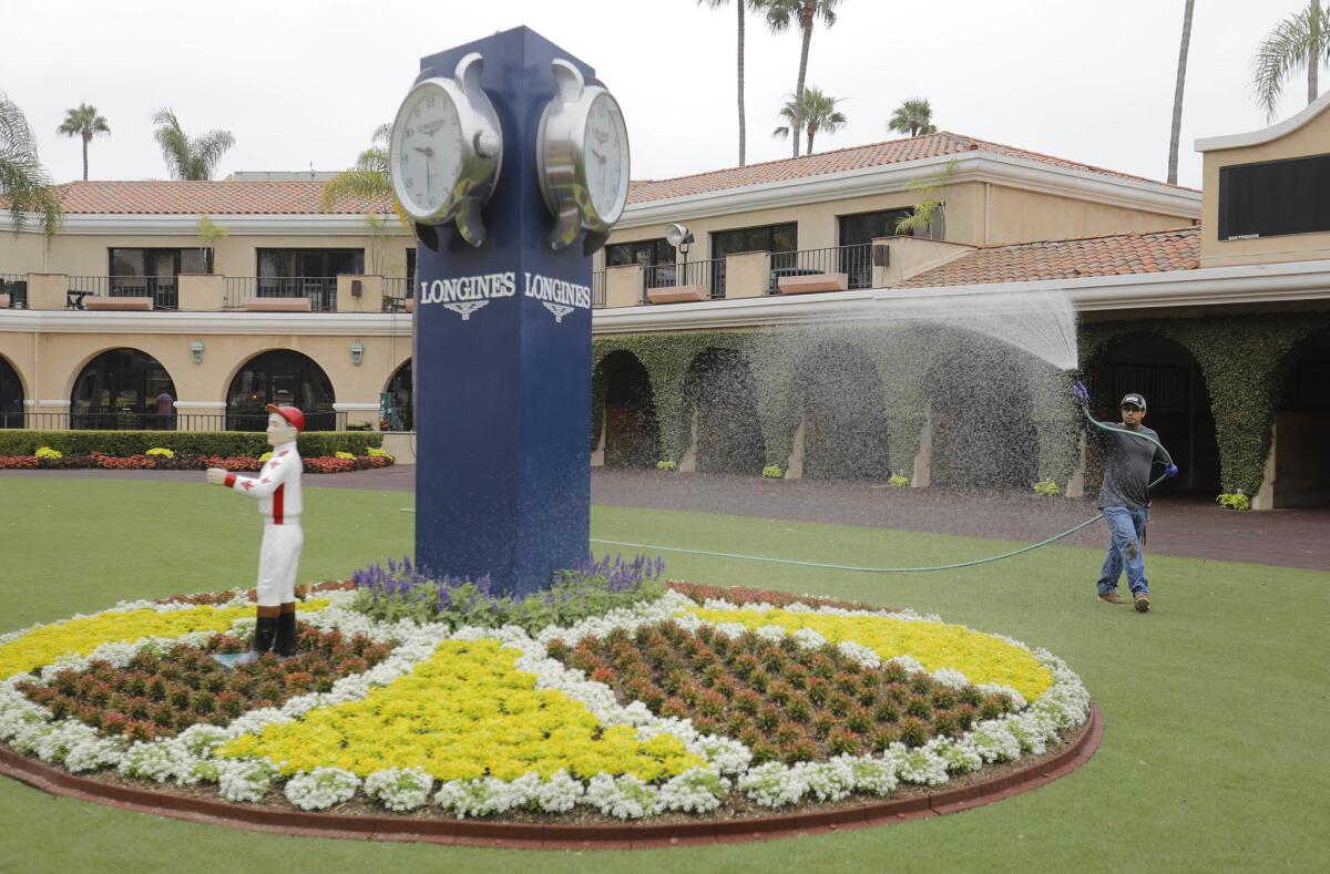 A worker prepares Del Mar for the start of the summer season.