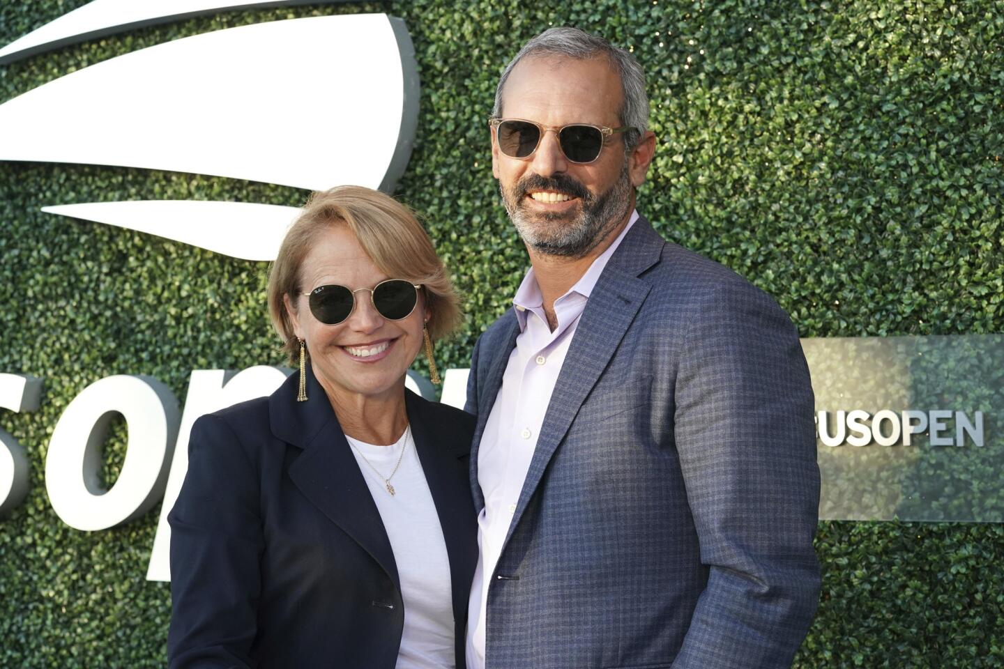 Katie Couric, left, and John Molner attend the quarterfinals of the U.S. Open tennis championships on Tuesday, Sept. 3, 2019, in New York.