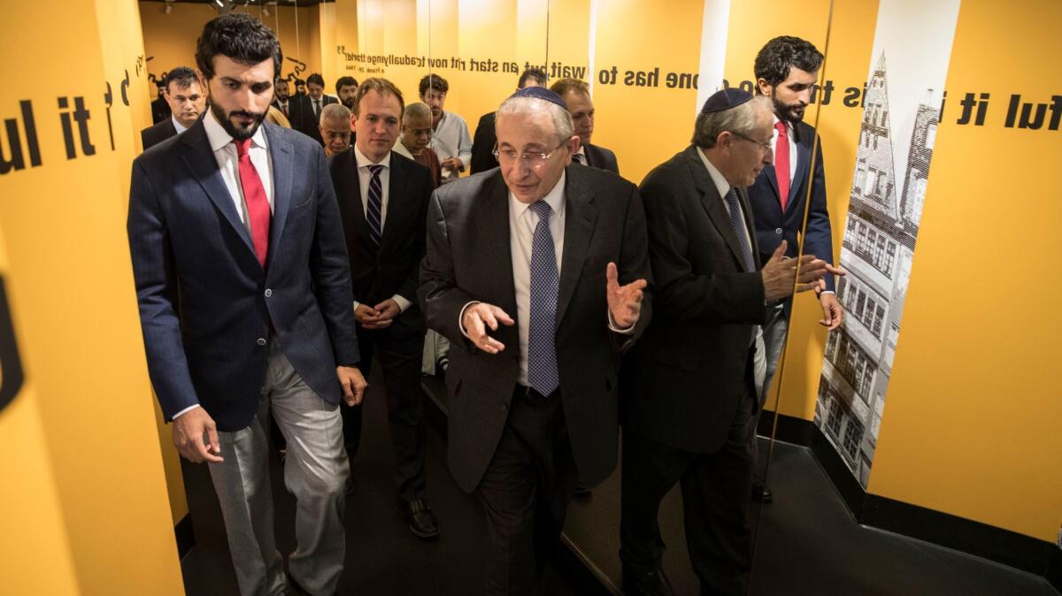 Prince Nasser bin Hamad al Khalifa of the Kingdom of Bahrain, left, tours the Anne Frank exhibit at the Museum of Tolerance with Simon Wiesenthal Center founder Rabbi Marvin Hier, right.