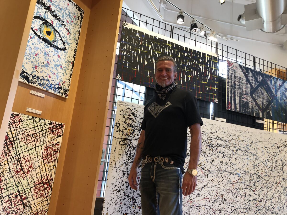 Todd Parker with some of his artwork.