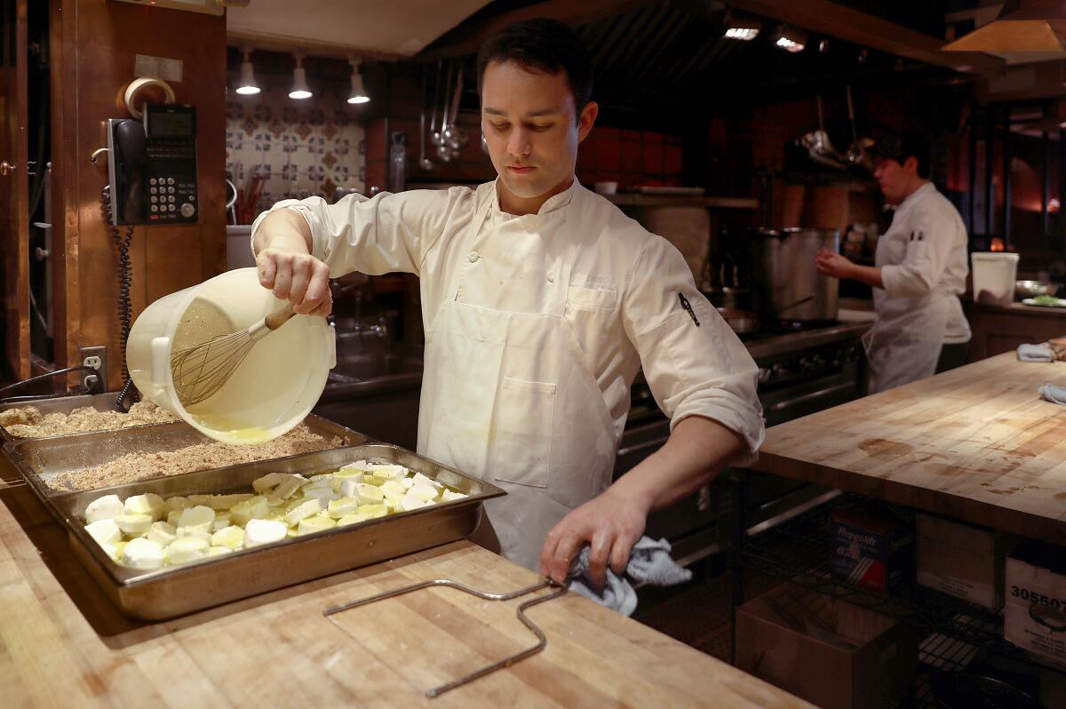 Kitchen workers prepare food at Chez Panisse.