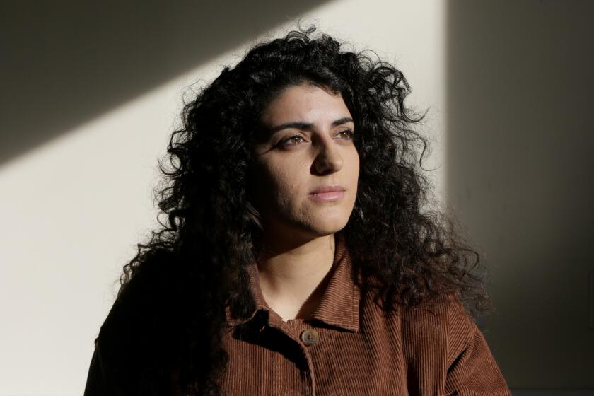 VAN NUYS, CA - Tuesday, Dec. 10 Sophia Armen, an Armenian American activist, poses for a portrait at her childhood church, St. Peter’s Armenian Apostolic, on Tuesday, Dec. 10, 2019. According to Armen, the Armenian community there was all but destroyed during the genocide and to this day Turkey denies that these Armenians existed. (Photographs by Gabriella Angotti-Jones/Los Angeles Times)