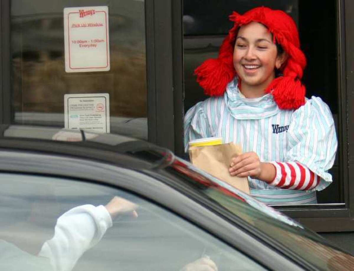 A worker at a Wendy's drive-thru. The chain had the fastest drive-thrus in the industry last year, filling orders in an average of 145.5 seconds.