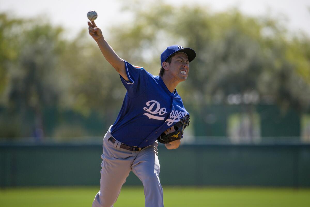 GLENDALE, ARIZONA - FEBRUARY 29, 2016: Dodgers pitcher Kenta Maeda throws live batting practice for the first time to Dodger hitters during spring training on February 29, 2016 in Glendale, Arizona.(Gina Ferazzi / Los Angeles Times)