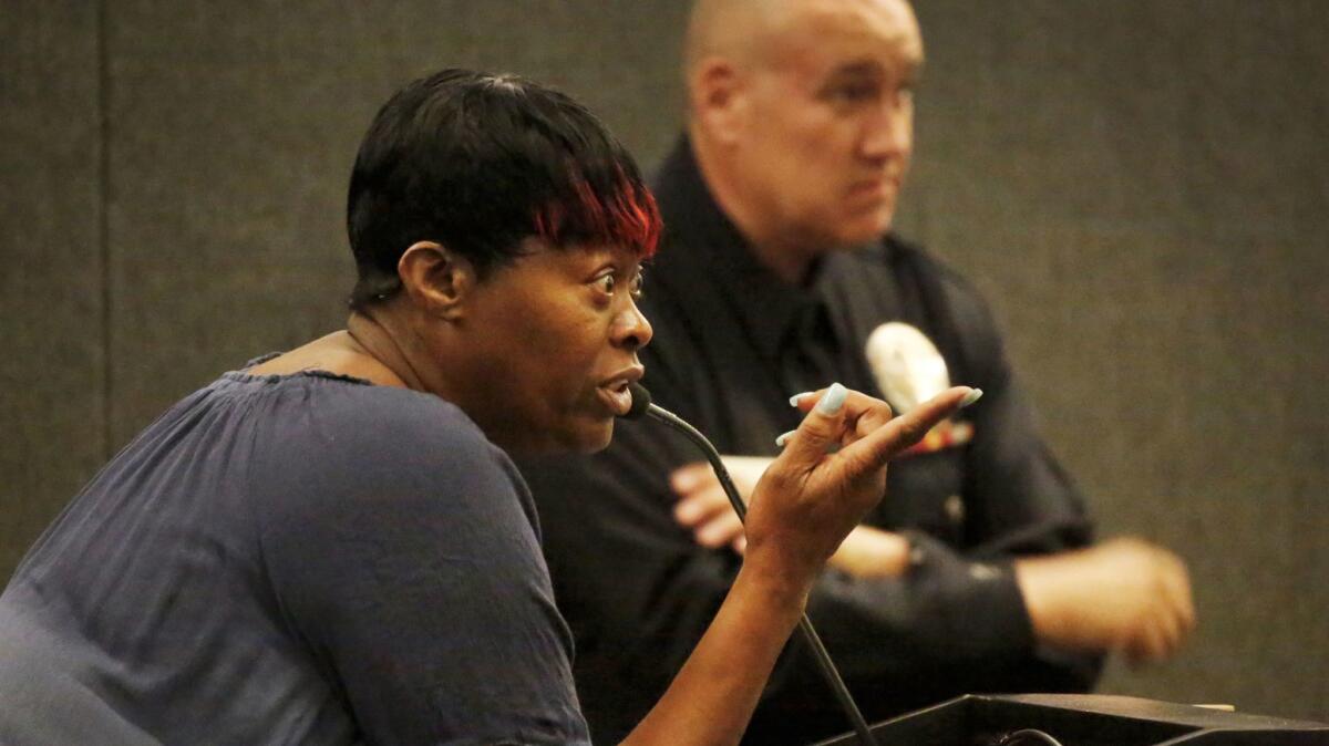 Lisa Simpson mother of Richard Risher, points at LAPD Chief Charlie Beck during the Police Commission meeting at LAPD headquarters.
