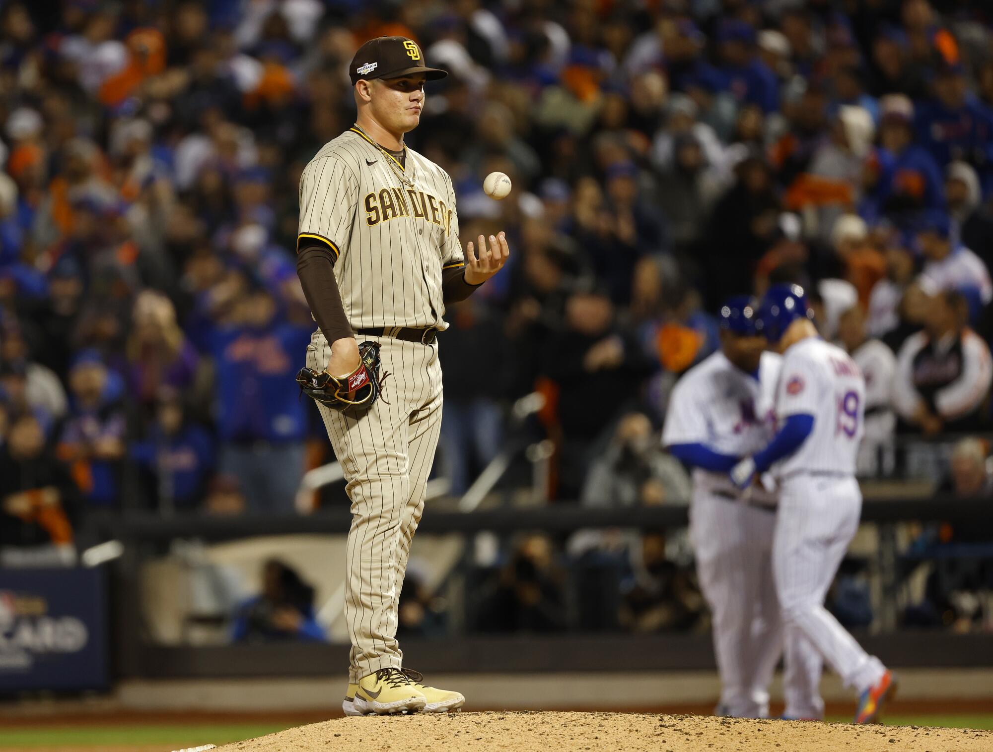 Padres pitcher Adrian Morejon stands on the mound after walking the Mets' Mark Canha to load the bases in the seventh inning.