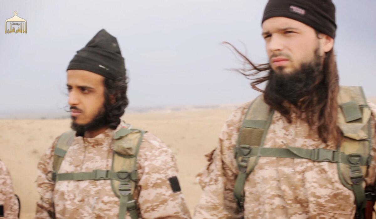 An image grab taken from an Islamic State propaganda video released on Nov. 16 shows a fighter, on the right, believed to be French citizen Maxime Hauchard.