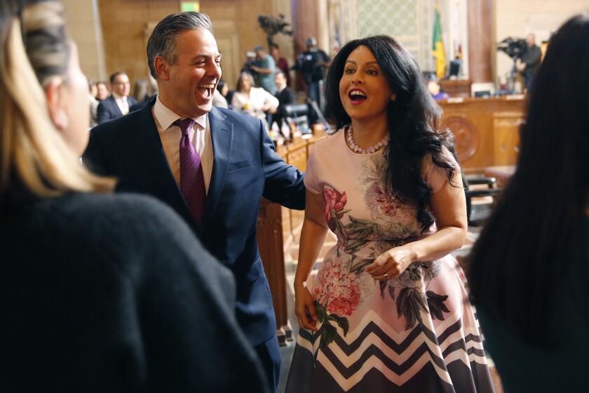 LOS ANGELES, CA - DECEMBER 03, 2019 Los Angeles City Councilwoman Nury Martinez with Councilmember Joe Buscaino who was voted president pro tempore before fellow Council members voted to elect Martinez as City Council President which makes her the first Latina president in Los Angeles City Council history and only the second woman elected Council President in City’s U.S. history dating back to 1850. (Al Seib / Los Angeles Times)