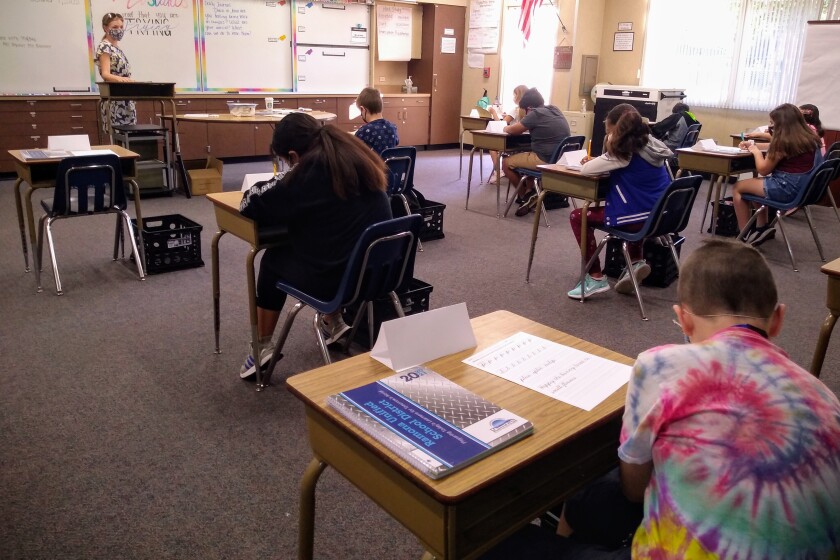 Californians vaccinated for COVID-19 can largely shed masks
on June 15 2 Students who were previously socially distanced 6 feet apart can now be separated by 3 feet under revised state guidelines.