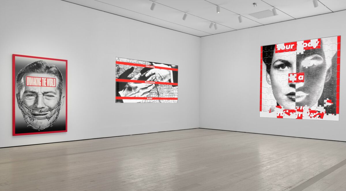 A gallery with three works by Barbara Kruger — two animated, one static — in the artist's palette of black, white and red