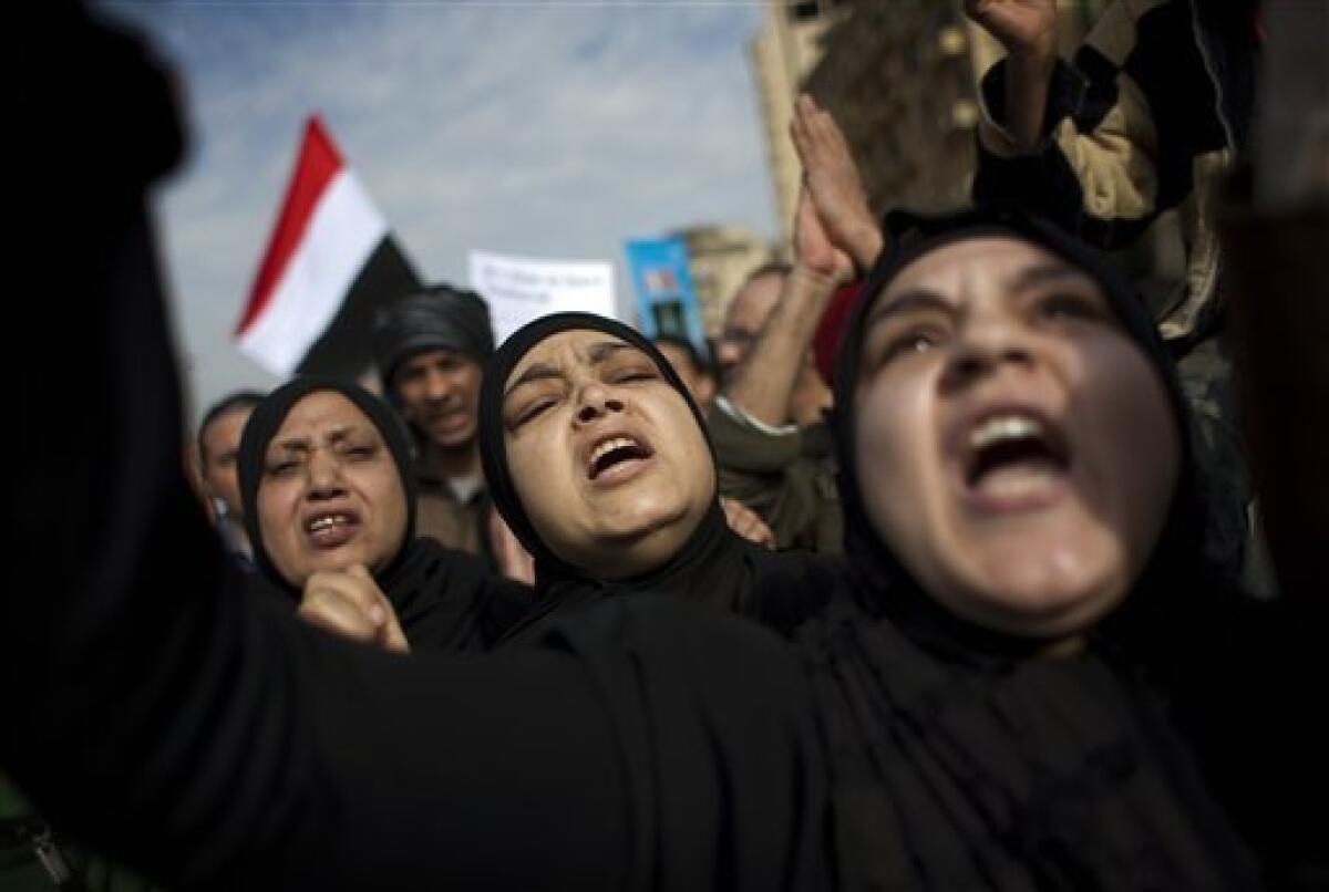 Anti-government protesters shout slogans as they march toward the Tahrir square in downtown Cairo, Egypt, Tuesday, Feb. 1, 2011. Egyptian authorities battled to save President Hosni Mubarak's regime with a series of concessions and promises to protesters, but realities on the streets of Cairo may be outrunning his capacity for change. (AP Photo/Emilio Morenatti)