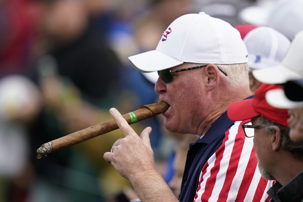 A fan backing USA smokes during a Ryder Cup  practice day at Whistling Straits Golf Course.